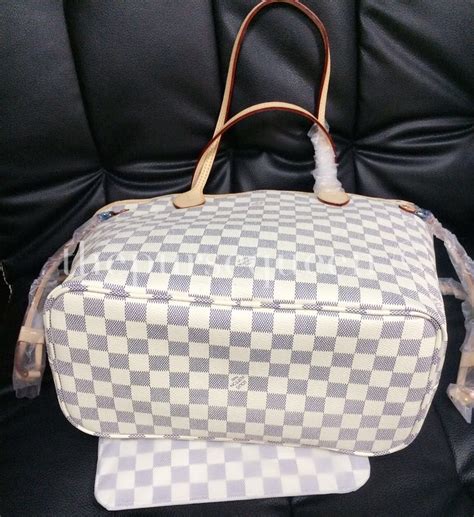 spot fake louis vuitton neverfull damier ebene|is louis vuitton neverfull real.